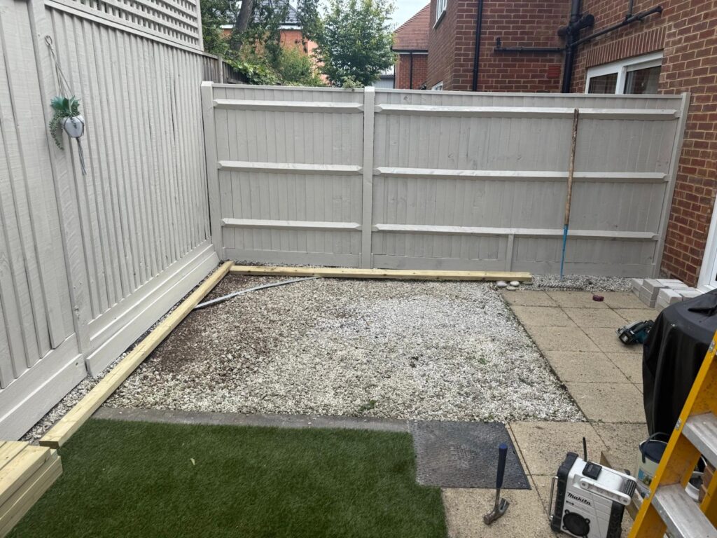 Artificial lawn lifted relevelled and relaid in new Milton before