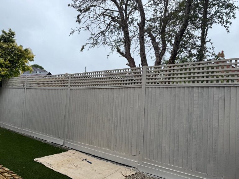 Artificial lawn lifted relevelled and relaid in new Milton trellis added