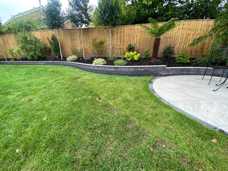 Indian sandstone paving new lawns, raised beds done for a lady in Barton on sea 2