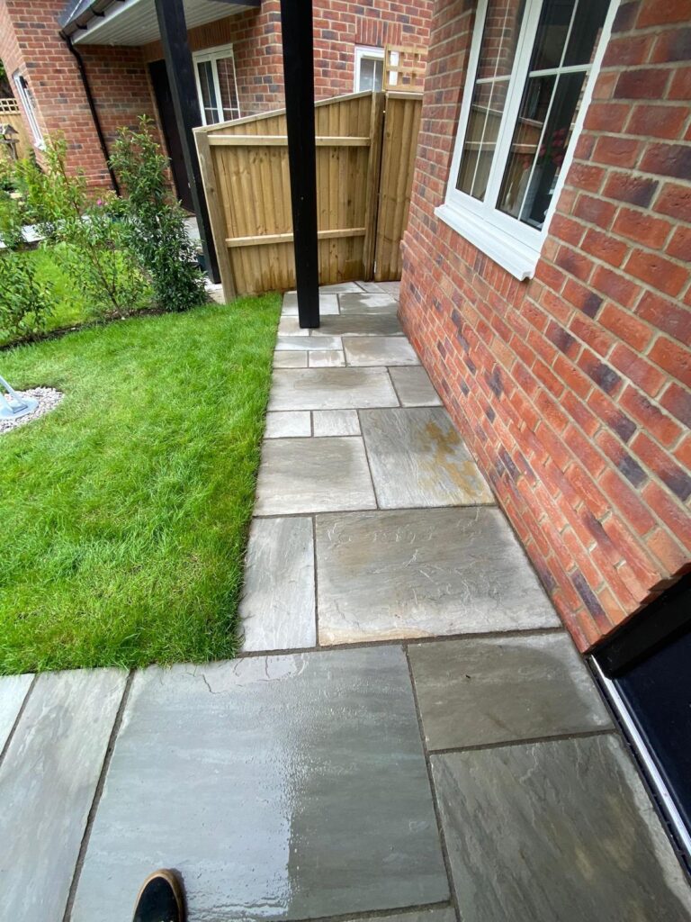 Indian sandstone paving new lawns, raised beds done for a lady in Barton on sea 4