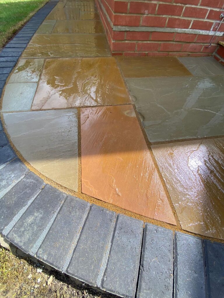 Indian sandstone paving with a charcoal pavia edge in Walkford 3