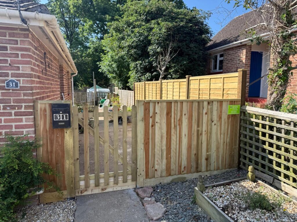 Pretty little closeboard fence and palisade gate Lymington after