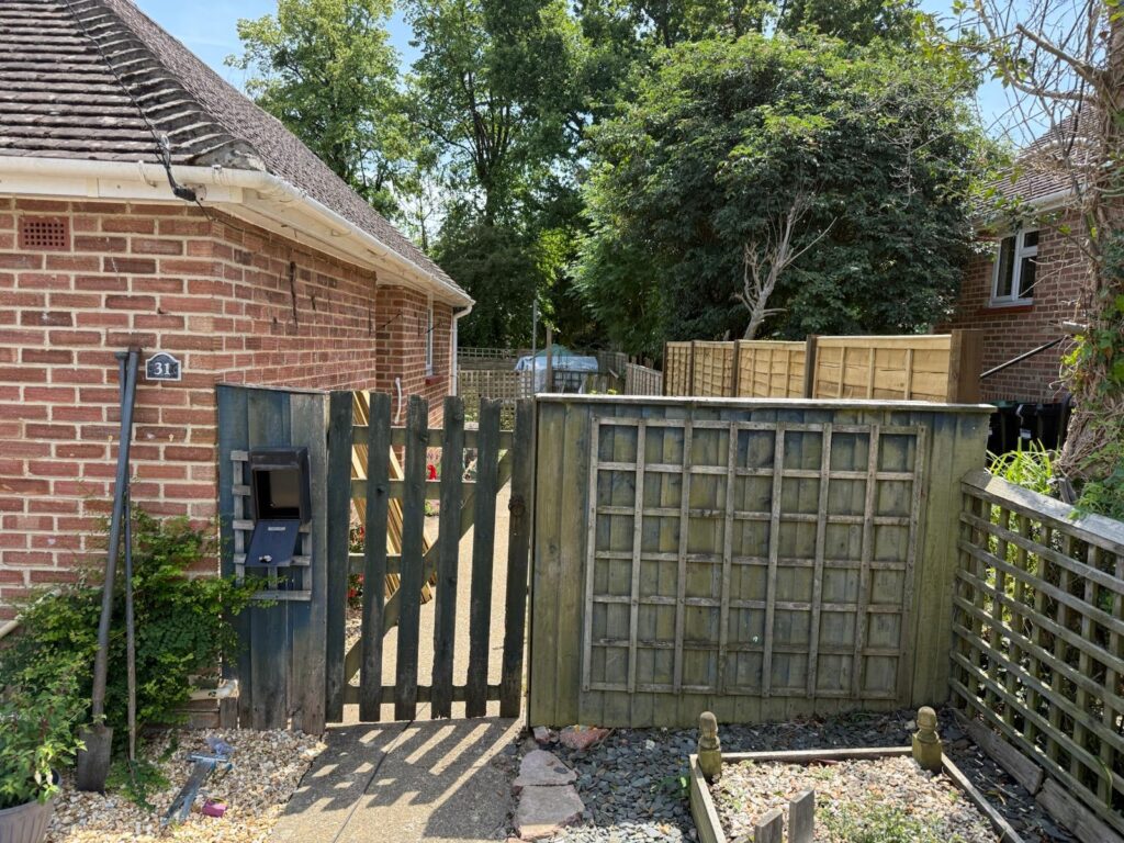 Pretty little closeboard fence and palisade gate Lymington before