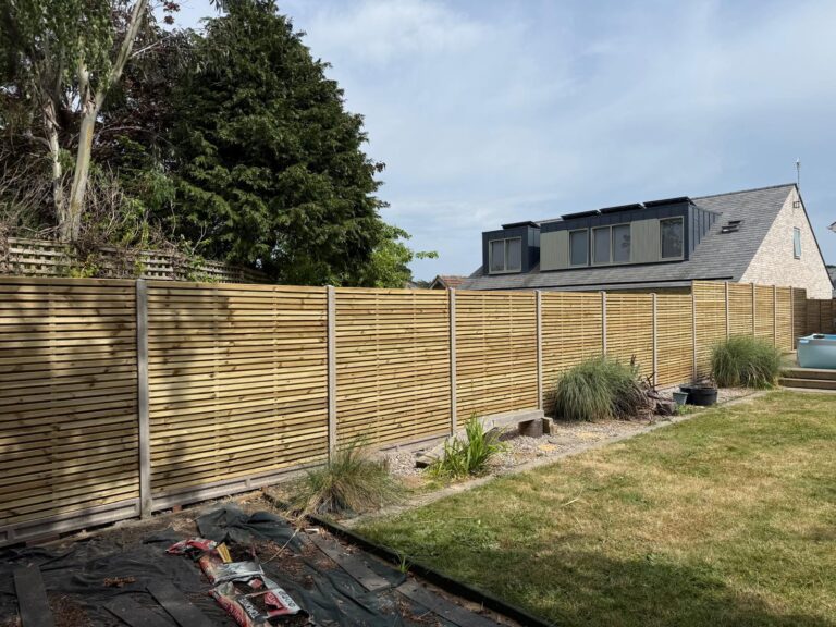 new double slated fence erected in Lymington after