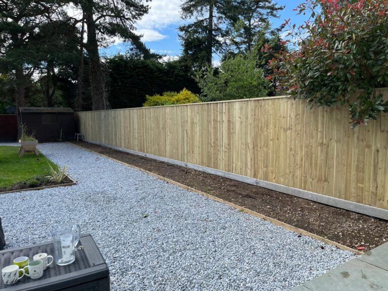 New timber fence panels along a garden boundary